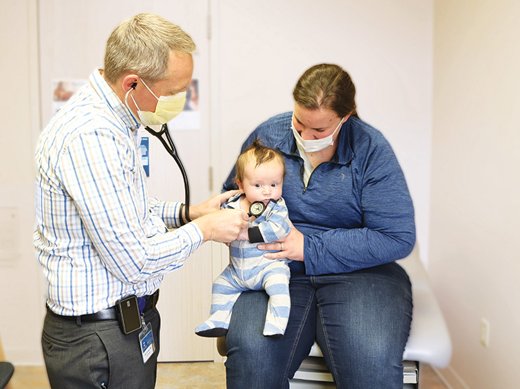 Meghan Harrod and her infant son with Dr. Goodner.