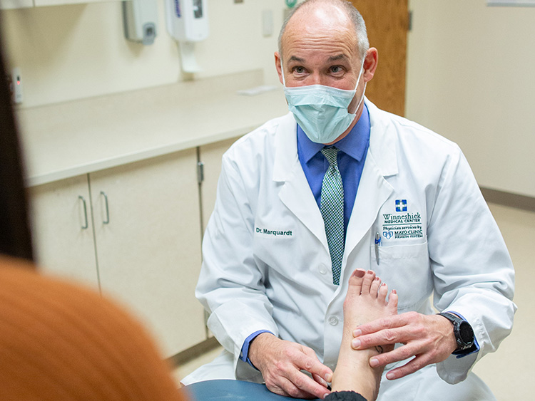 Dr. Marquardt talks to a patient.