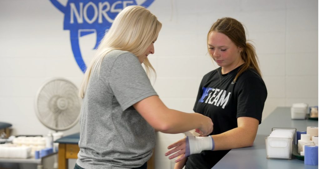 WinnMed Athletic Trainer with Luther College athlete. 