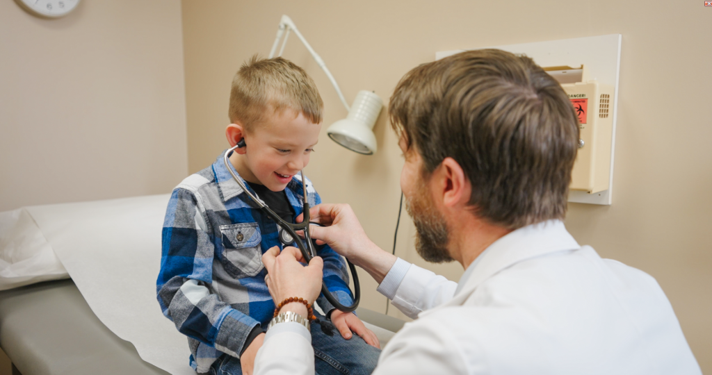 Dr. Menke listening to a patient's heart
