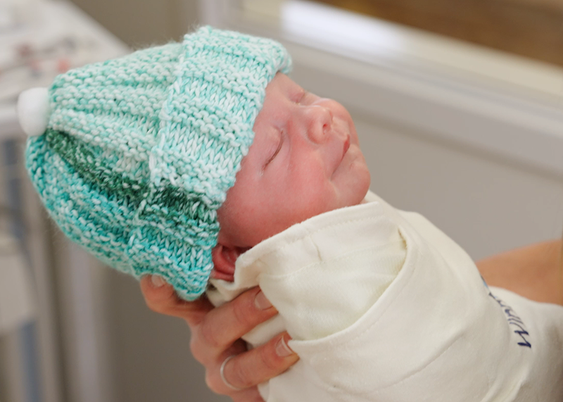 Nurse holding baby