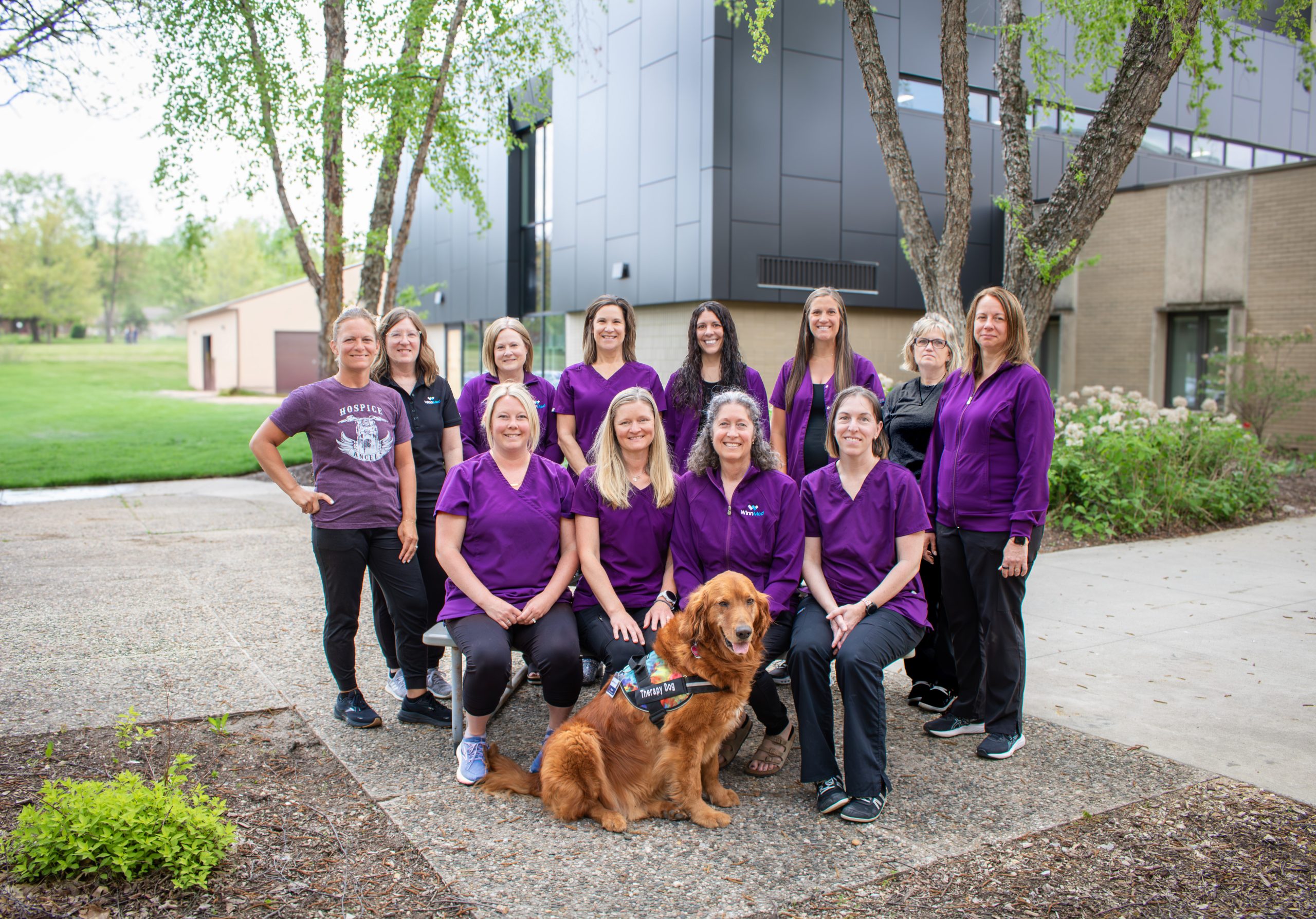 Hospice staff members shown on the WinnMed campus in front the Surgery Department.